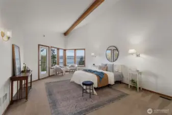 HUGE upper level primary suite with views, access to private balcony and several large closets.