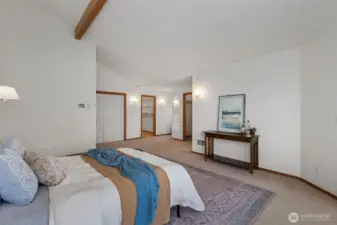 Another shot of the upper level primary looking on to closets and entrance to 5 piece primary bath.