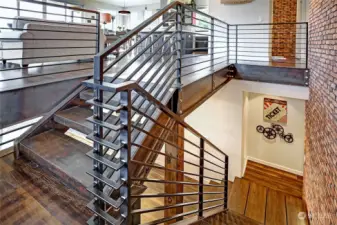 Check out the hefty beams and beautiful open wood stairs!