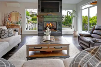The stunning centerpiece of the living area is this one of a kind, handcrafted, custom fireplace!