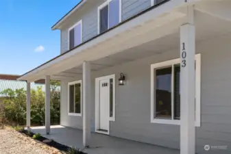 Covered front porch entry where you could spend your mornings with a cup of coffee to start your day - or entertain your friends, or enjoy a peaceful evening listening to the birds chirp.