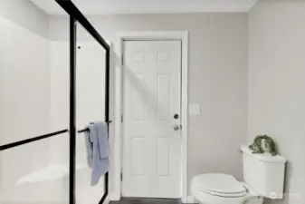 Primary bathroom with toilet and shower