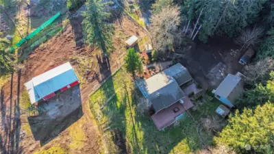 AREIL VIEW OF HOME, GARAGE, BARN AND PASTURE