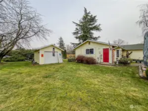 Side yard with one of the garages.