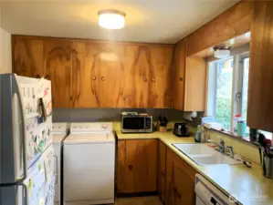 This is the original 1950's cabinets complete with the copper pulls.