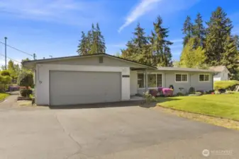 This beautiful north facing rambler awaits you at the end of the private driveway.