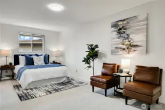 large primary suite has room for sitting area and features dual closets & 3/4 ensuite bath