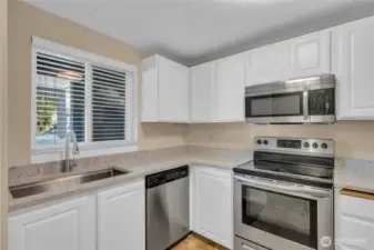 A sunny window in the kitchen lets in the natural light.