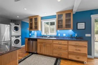 Warm hickory cabinetry adds natural charm and character to the space, blending beautifully with the home’s classic design.