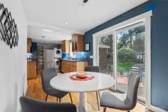 Enjoy meals with a view—sliders off the dining area lead to a peaceful, private backyard setting.