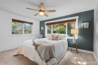Welcome to the primary bedroom—a comfortable, light-filled retreat with thoughtful touches throughout.