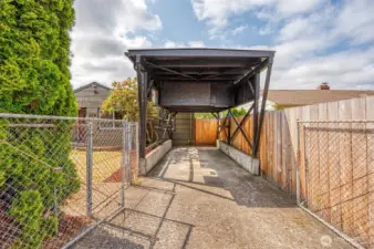 RV carport with storage give options! has storage above and electrical, has a secondary gate.