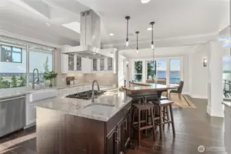 The chef’s kitchen boasts a spacious island perfect for meal prep and casual dining.