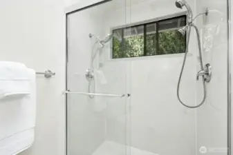 Freshly painted bath with new lighting and fan.