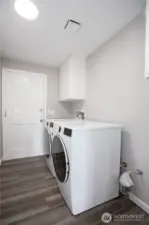 Laundry room, with entry into the garage.