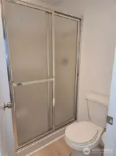 Privacy door separates the shower room from the vanity.