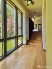 Landing area connects to bathroom and bedroom with stairs leading to the family room.