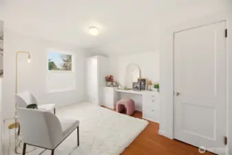 Fourth bedroom offers versatile space with built in desk and storage. Could serve as a guest room, home office, or hobby room.