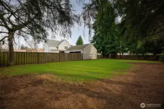 Expansive fully fenced backyard offers a private outdoor setting ideal for relaxing or entertaining.