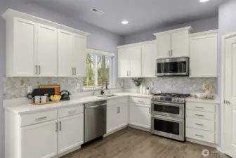 new countertops, sink, hardware and painted cabinets
