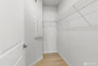 Walk in closet in the primary bedroom.