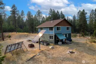 Smart Generator under covering, just out the backdoor, off of the utility room