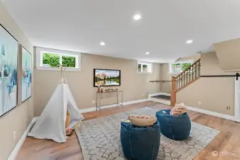 Take advantage of the large family room located at the bottom of the basement stairs.  Windows allow a good deal of light in and the floor has radiant heat.  This is a very flexible space.