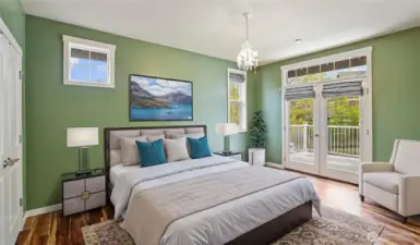 2nd bedroom includes double closets, a private deck, and custom lighting that casts a warm glow, creating a perfect blend of comfort and style. *Virtually Staged*