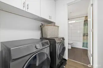Laundry Area with Built-In Storage Solutions!