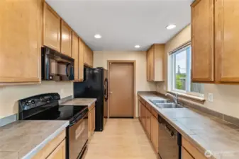 Plenty of prep space, bold black appliances, and a layout that works as hard as you do.