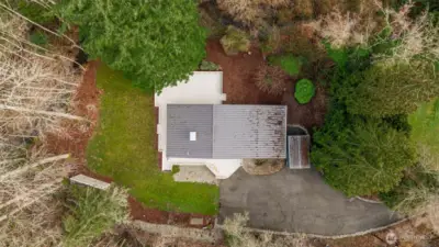 Surrounded by mature landscaping.