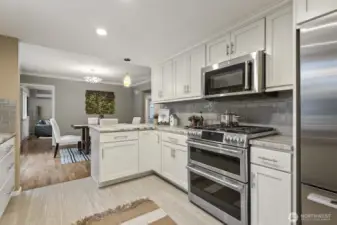 Newer stainless steel appliances in the kitchen are included, along with the washer and dryer and the garage fridge/freezer.
