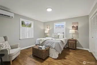 Spacious main-floor primary bedroom with easy access to living areas.