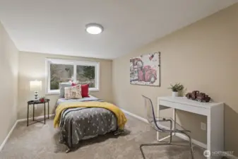 One of four upstairs bedrooms with scenic views.