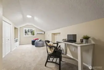 At the end of the hallway, the fourth bedroom or playroom features ample built-ins and closet storage.
