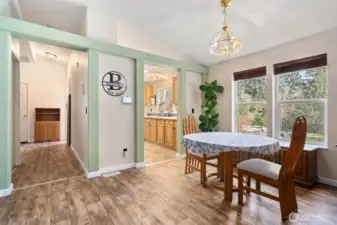 Dining, Kitchen, and hallway to secondary bedrooms.