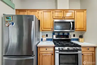 Gas Range, Microwave, and Refrigerator Convey