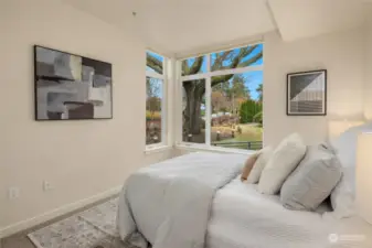 Second bedroom with view to heritage tree