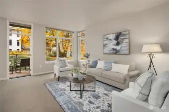 The living room is spacious and this corner unit has abundant light!