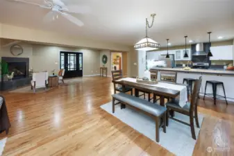 View from lake side entry of kitchen, dining area and fireplace.