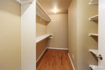 Walk in closet in primary bedroom.