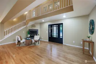 View of the front door and cozy propane fireplace.  You can sit right down and warm up in the winter months.