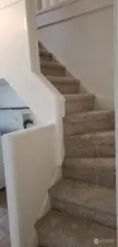 Stairs to access 2nd floor of upper unit and primary bedroom
