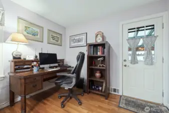 Den leads to covered outdoor patio