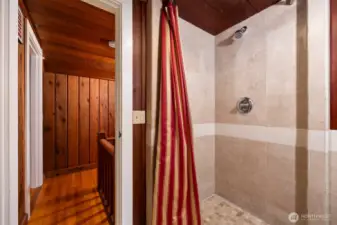 Tiled shower in upstairs bathroom