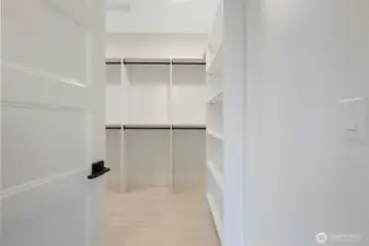 primary closet with full shelving