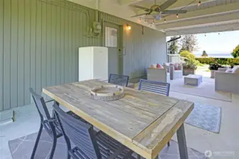 A covered breeze way for simple gatherings, coffee...and sunsets too. This home lives beautifully!