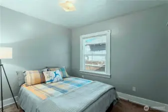 The main bedroom easily accommodates this queen sized bed. (A king sized would fit, too.)
