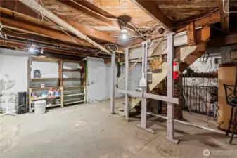 The basement is poured concrete and has good ceiling height. The water heater is located here.
