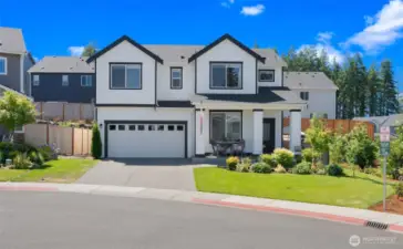 Tucked at the end of a peaceful cul-de-sac, this striking black-and-white residence captivates with timeless style, vibrant landscaping, and like-new move-in condition.